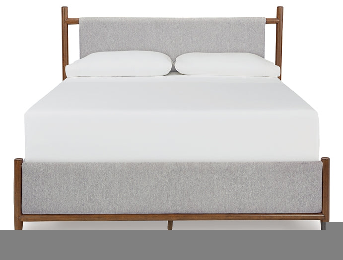 Lyncott Queen Upholstered Bed with Mirrored Dresser