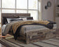 Derekson King Panel Bed with 2 Storage Drawers with Mirrored Dresser