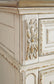 Realyn California King Upholstered Panel Bed with Mirrored Dresser