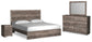 Ralinksi King Panel Bed with Mirrored Dresser and Nightstand