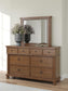 Chadworth King Poster Bed with Mirrored Dresser